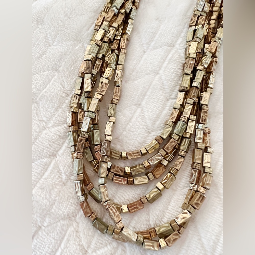 Multi layered gold tone beaded necklace